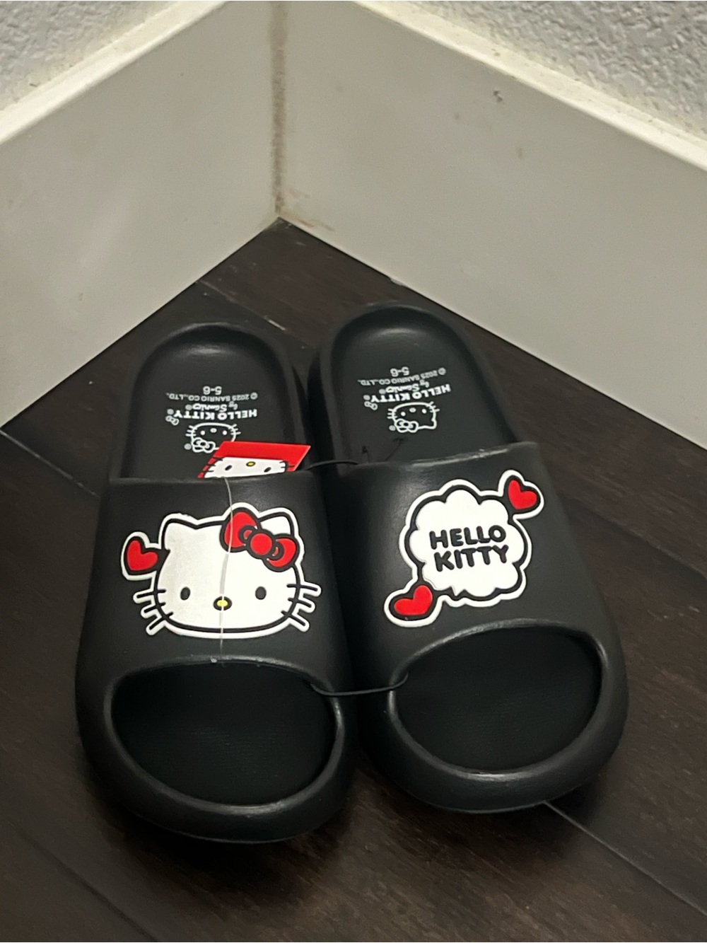 Hello Kitty Black Slide Sandals with Red and White Accents